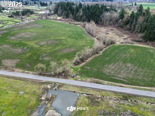 South Macksburg Canby, OR 97013 - Photo 4 of 5 a view of a lake with a yard and large trees
