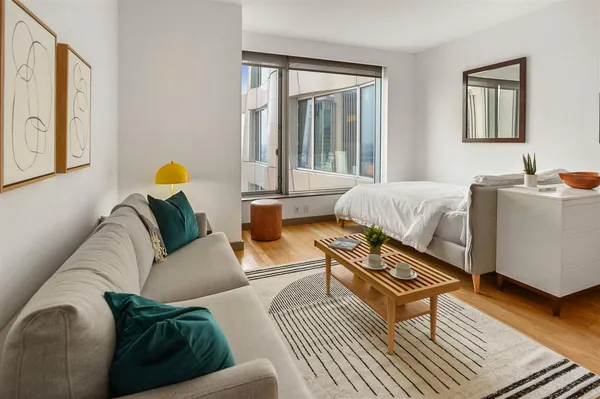 a living room with furniture and a window