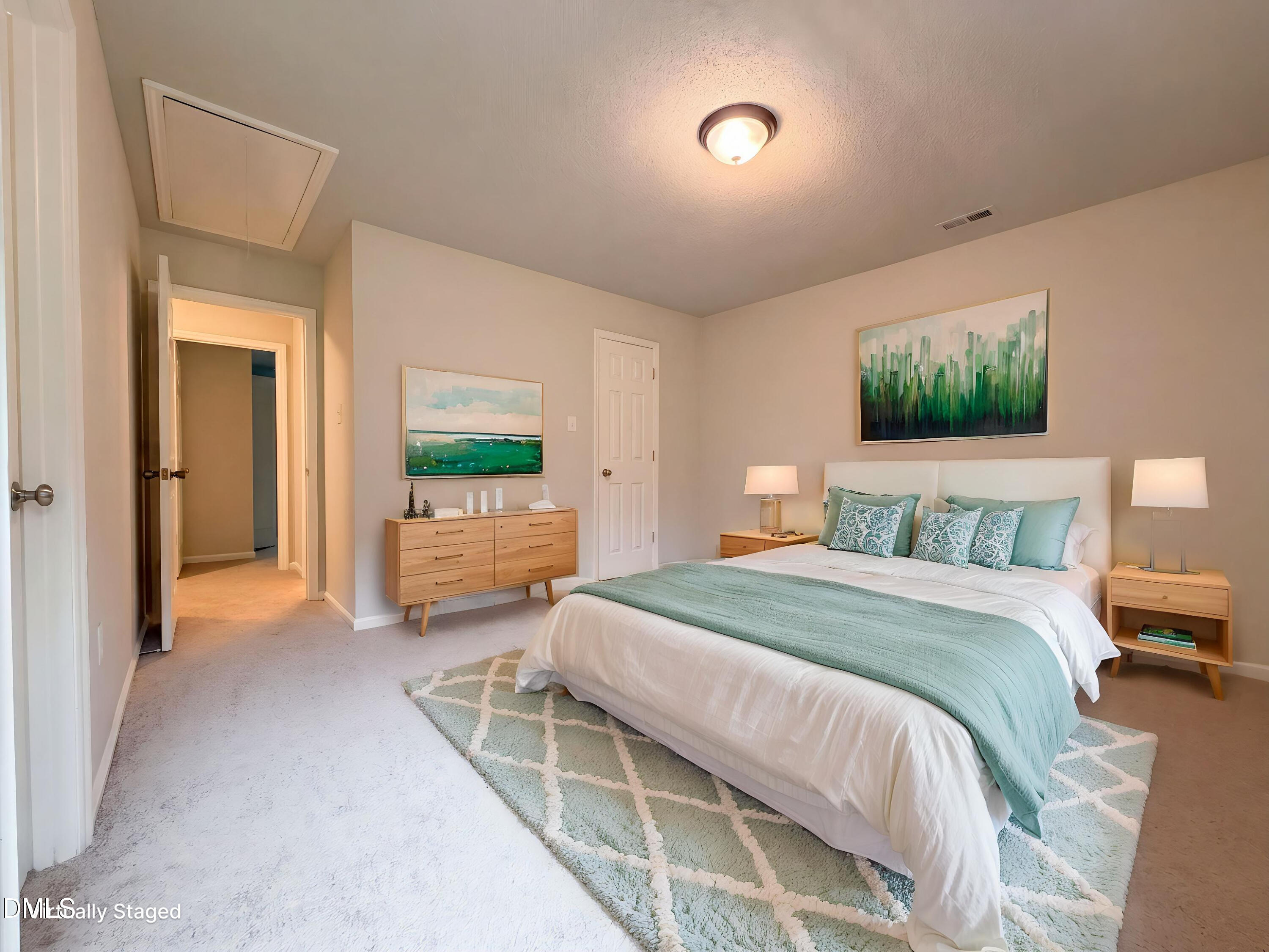 4894 Elevation Road, Unit C Benson, NC 27504 - Photo 10 of 24 a bedroom with a bed and a flat screen tv