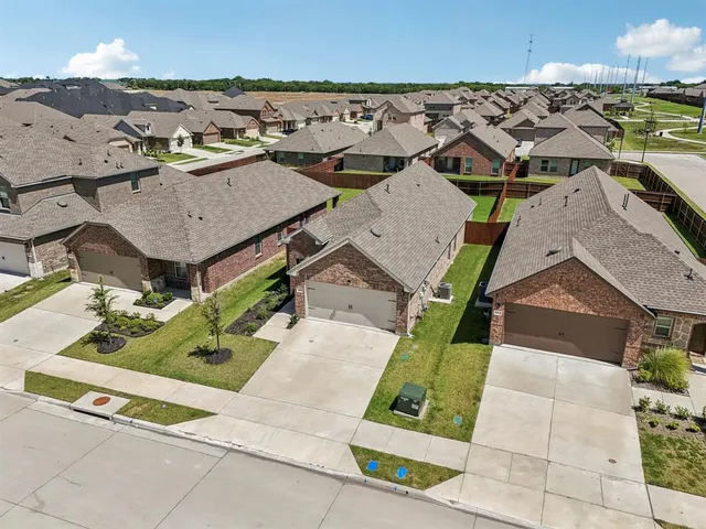 an aerial view of a house with a garden