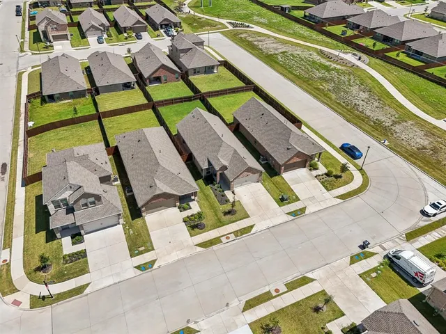 an aerial view of a tennis ground with a patio