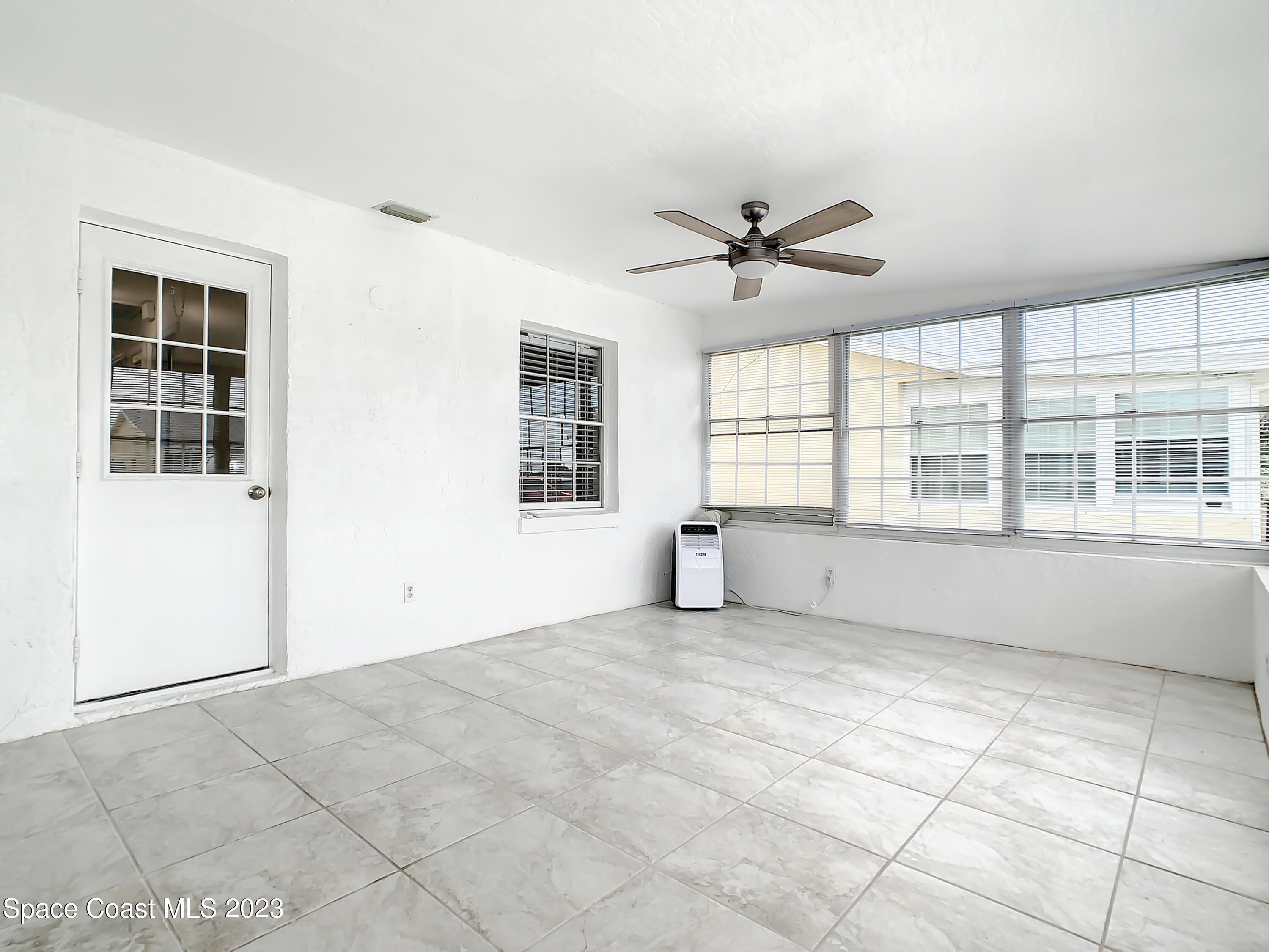 8520 Highway 1, Unit E9 Micco, FL 32976 - Photo 18 of 24 a view of an empty room with a window