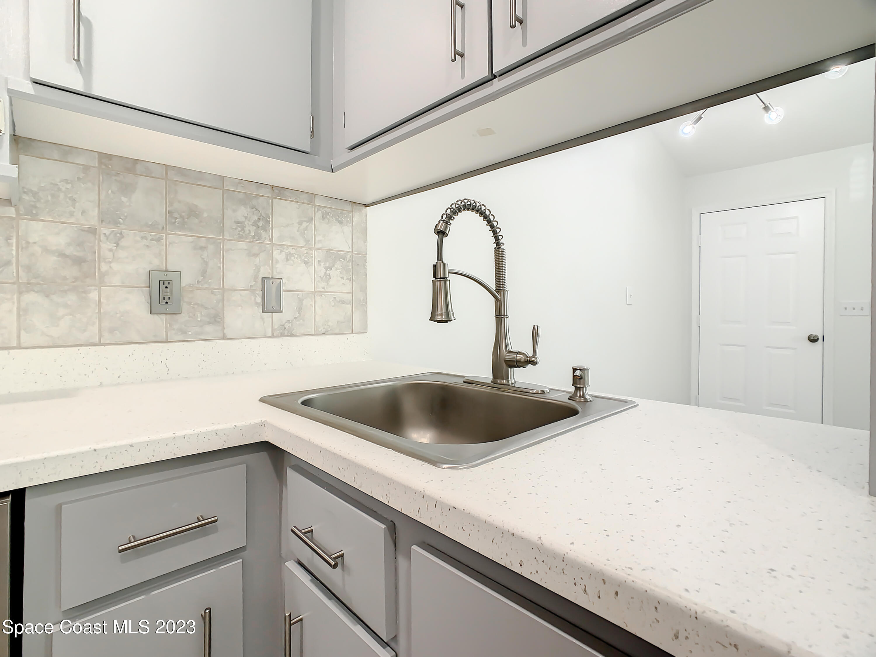 8520 Highway 1, Unit E9 Micco, FL 32976 - Photo 8 of 24 a kitchen with a sink and cabinets