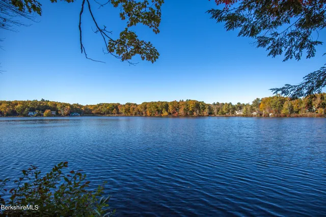 a view of lake with sunset