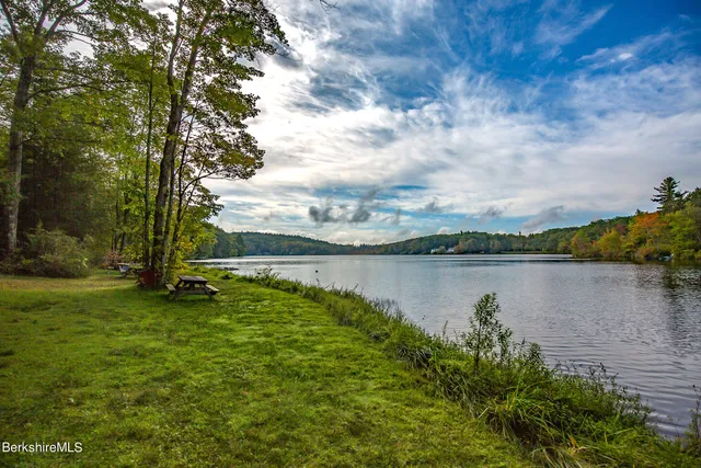 a view of a lake with a yard