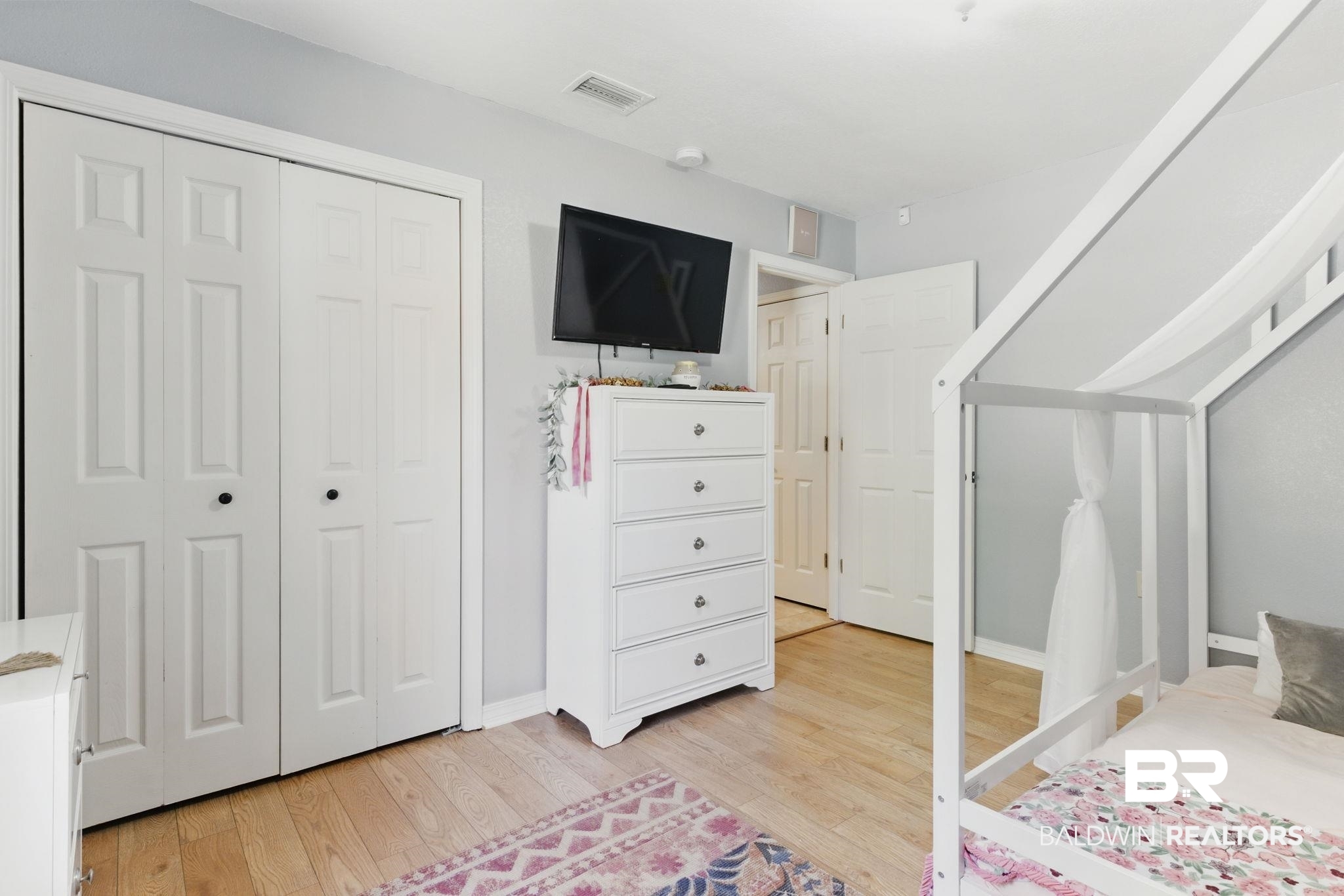 32345 River Lake Road Seminole, AL 36574 - Photo 29 of 56 Bedroom with visible vents, baseboards, light wood finished floors, and a closet
