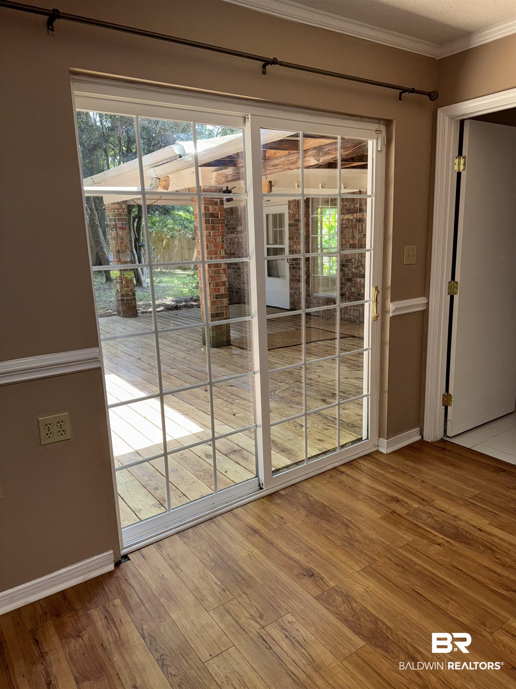 8070 Middle Ring Road Mobile, AL 36619 - Photo 14 of 26 Entryway with crown molding and wood finished floors