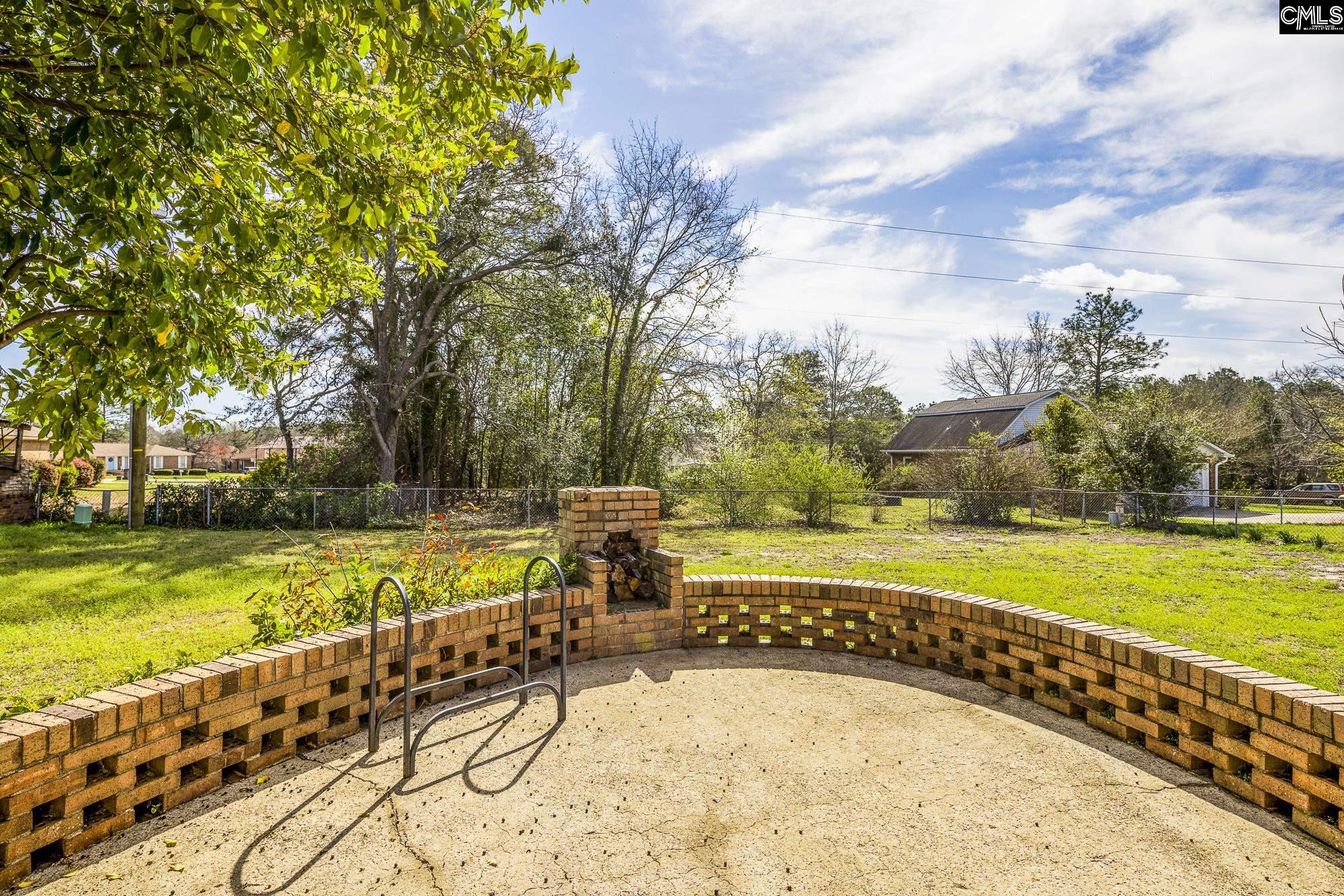 4083 Platt Springs Road West Columbia, SC 29170 - Photo 35 of 35 a view of a swimming pool with a lawn chairs and a big yard
