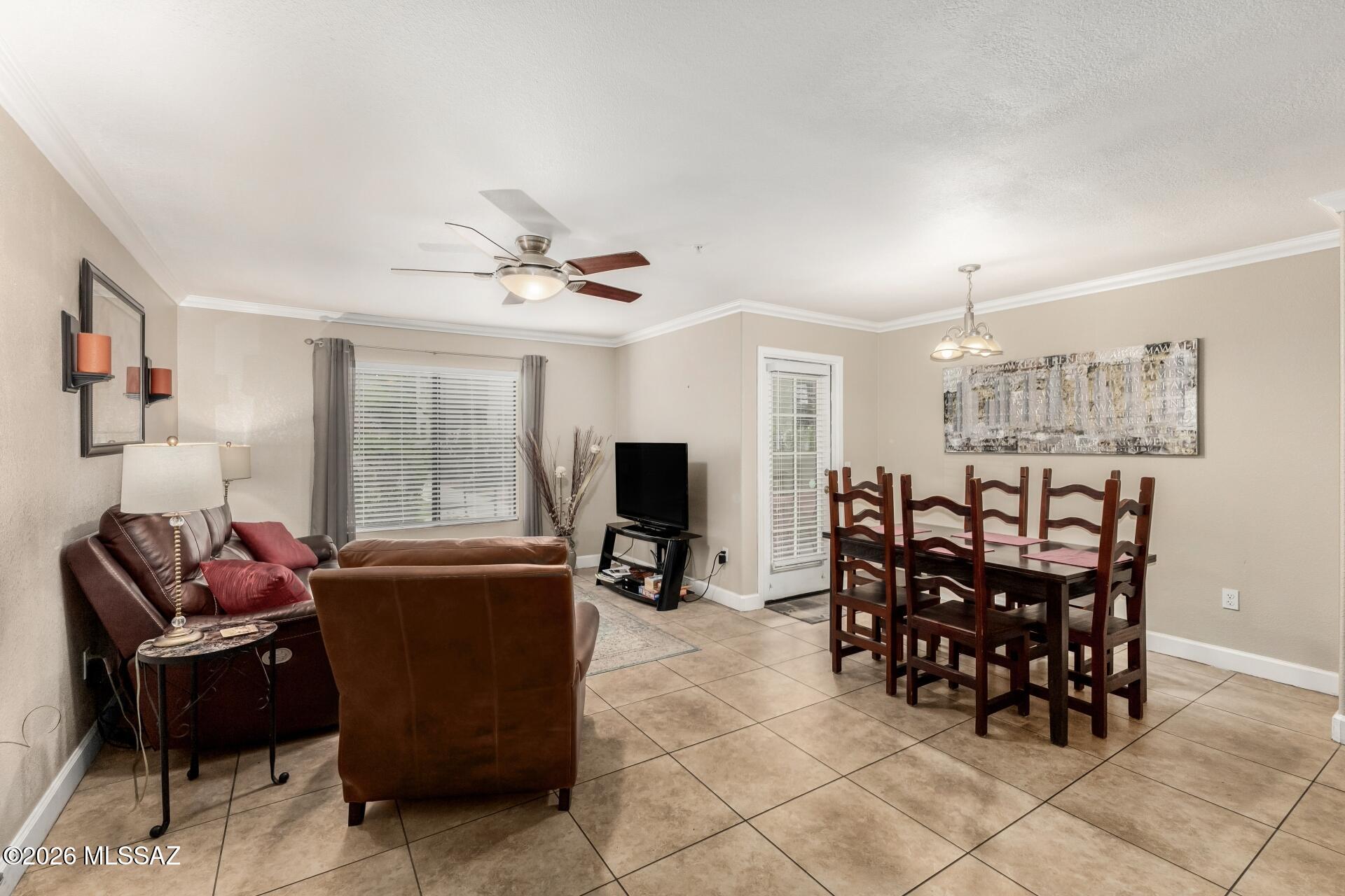 5751 North Kolb Road, Unit 25103 Tucson, AZ 85750 - Photo 5 of 24 Plenty of room for entertaining. Patio access just beyond the dining area.
