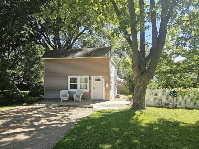 a house that has tree in front of it