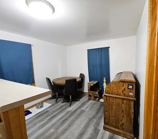 a workspace with furniture and wooden floor