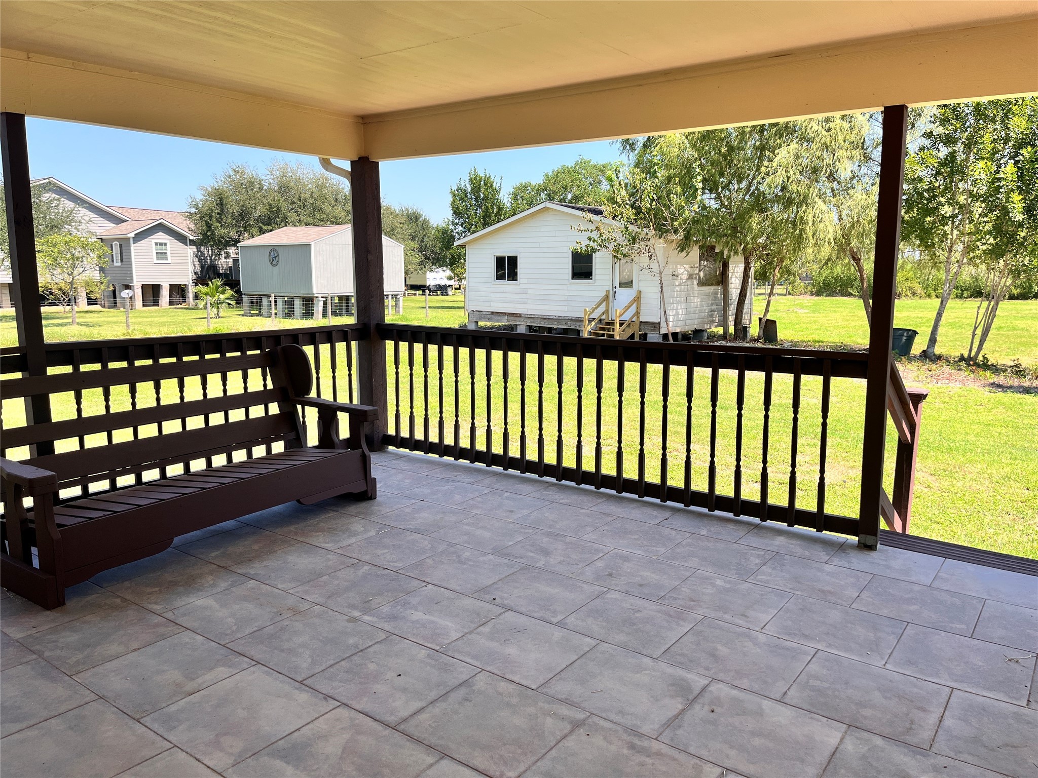 1010 Aurelia Lane Rosenberg, TX 77471 - Photo 24 of 29 a view of a porch with wooden floor and iron fence