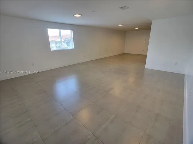 an empty room with closet area