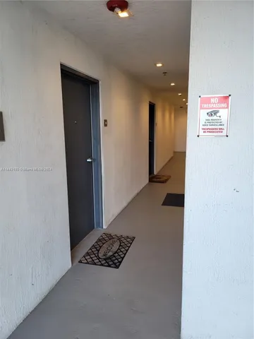 a view of a room with an empty room and window