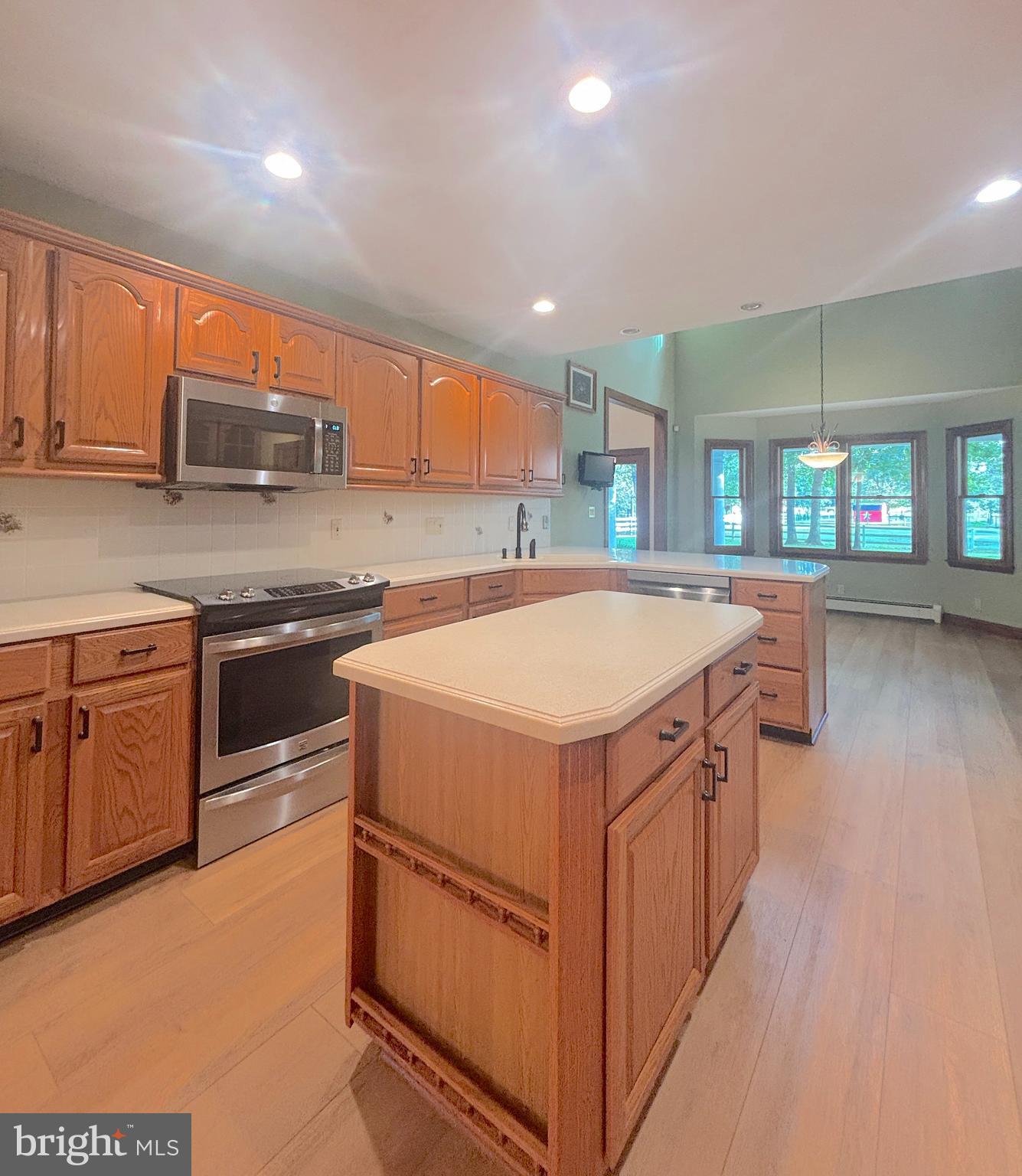 3138-3142 Moss Mill Road Hammonton, NJ 08037 - Photo 17 of 73 a kitchen with a stove sink and a microwave