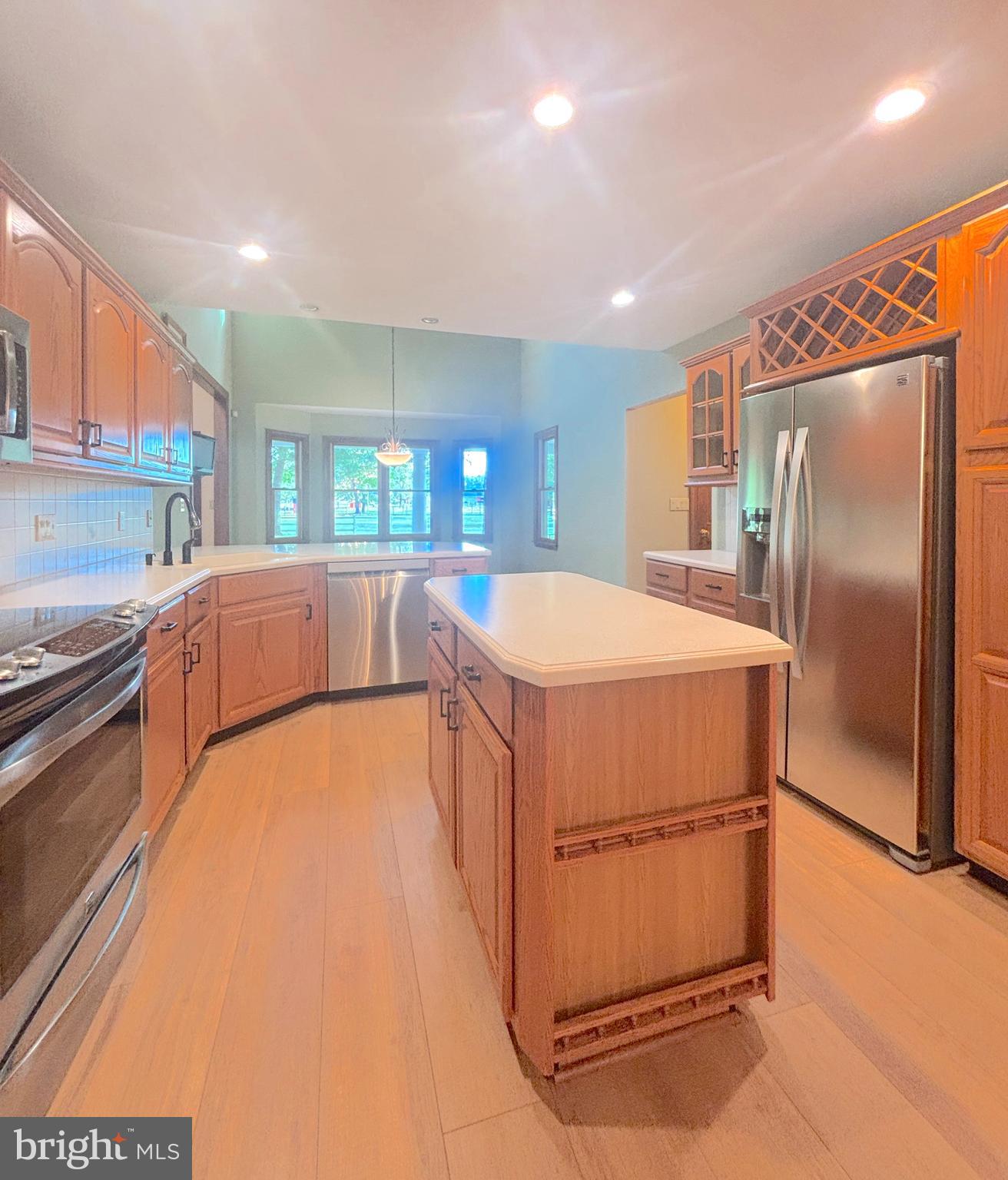 3138-3142 Moss Mill Road Hammonton, NJ 08037 - Photo 18 of 73 a large kitchen with stainless steel appliances a refrigerator and a counter space