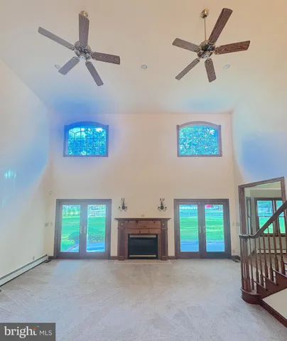 a bathroom with bathtub and window