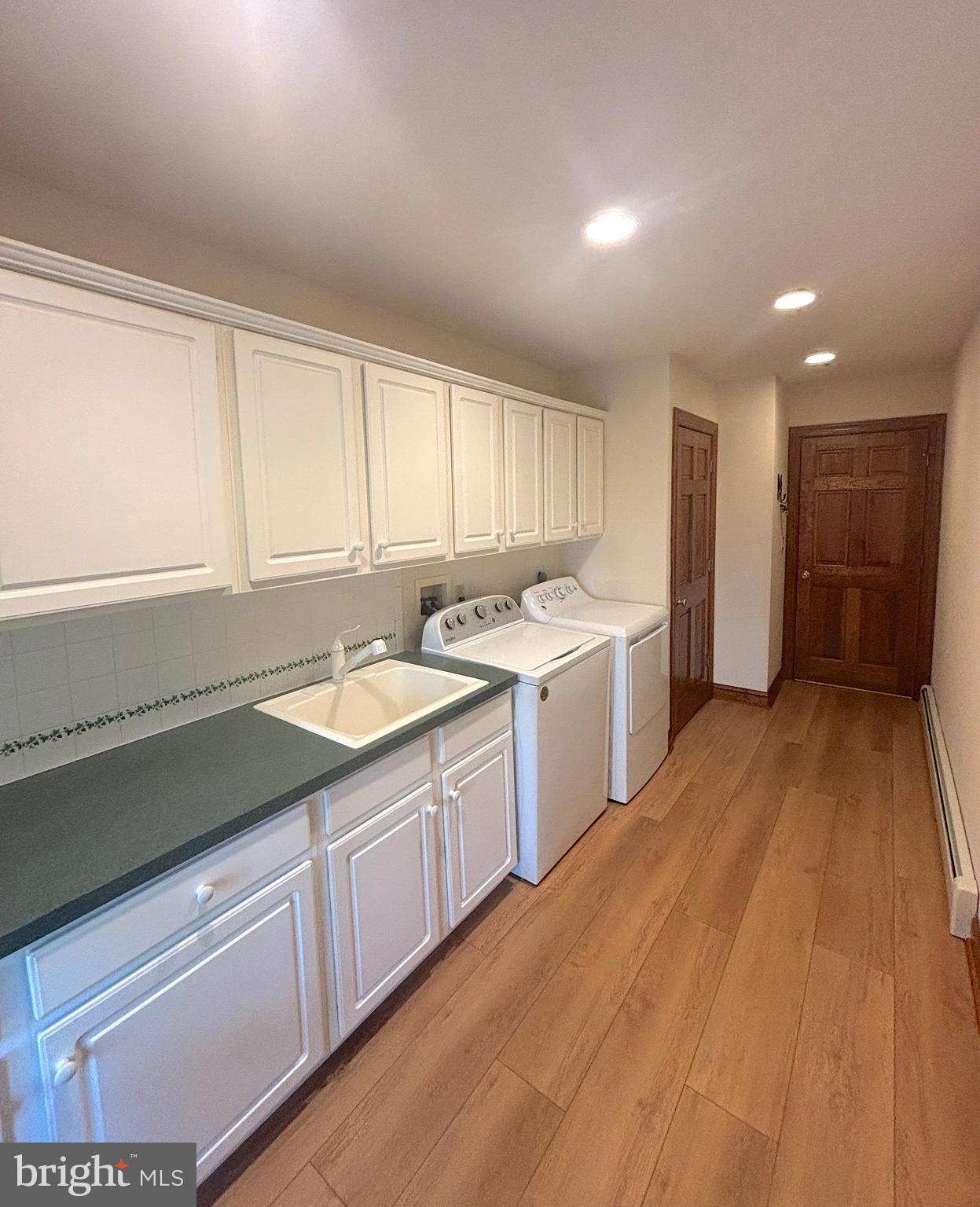 3138-3142 Moss Mill Road Hammonton, NJ 08037 - Photo 39 of 73 a kitchen with a sink stove and cabinets