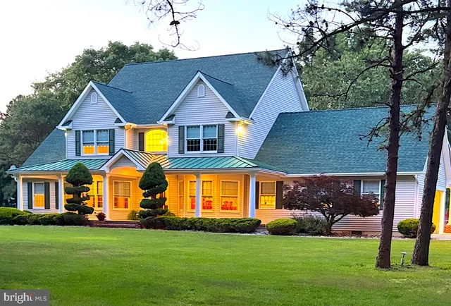 a large white kitchen with a large window