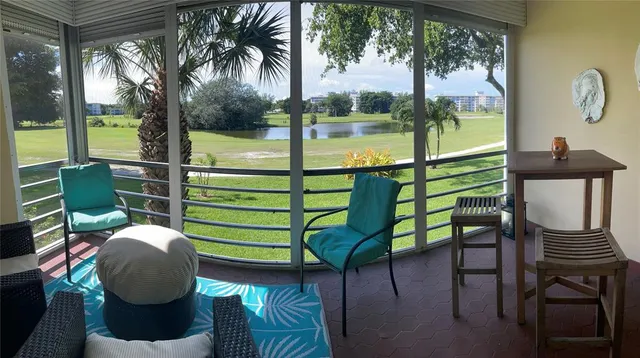 a view of a chairs and table in patio