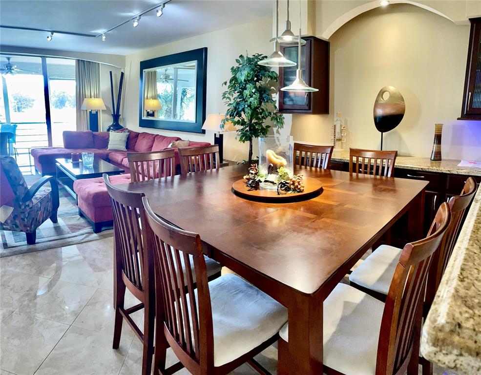 2681 South Course Drive, Unit 212 Pompano Beach, FL 33069 - Photo 4 of 16 a dining room with furniture and wooden floor