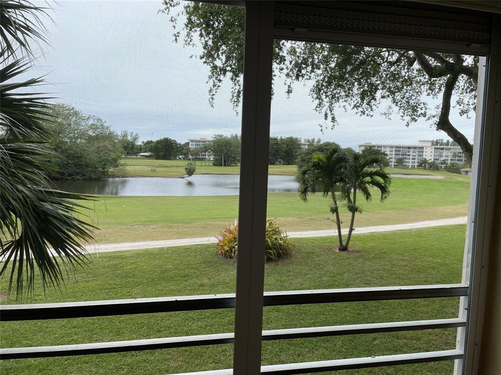 2681 South Course Drive, Unit 212 Pompano Beach, FL 33069 - Photo 8 of 16 a view of lake from a window