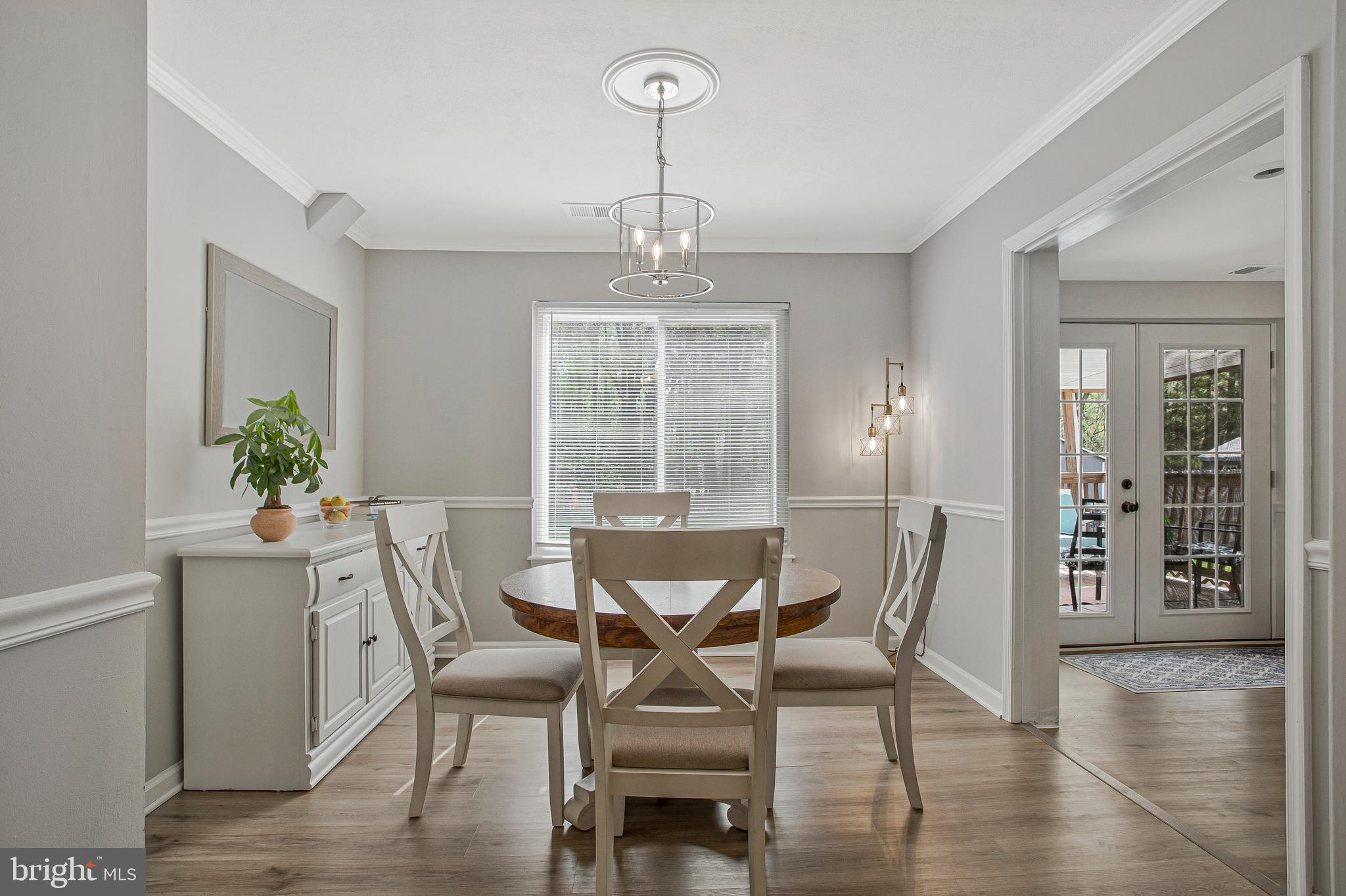 114 River Road Edgewater, MD 21037 - Photo 15 of 30 a view of a dining room with furniture window and wooden floor