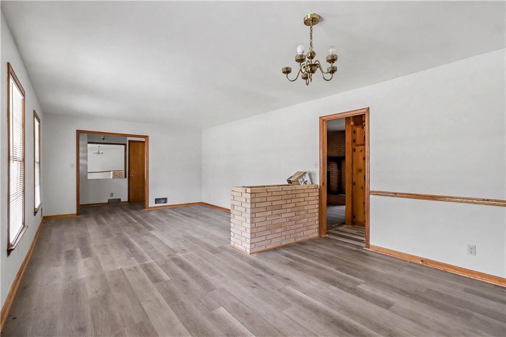 1315 Fairview Road Ellenwood, GA 30294 - Photo 12 of 34 wooden floor in an empty room with a window