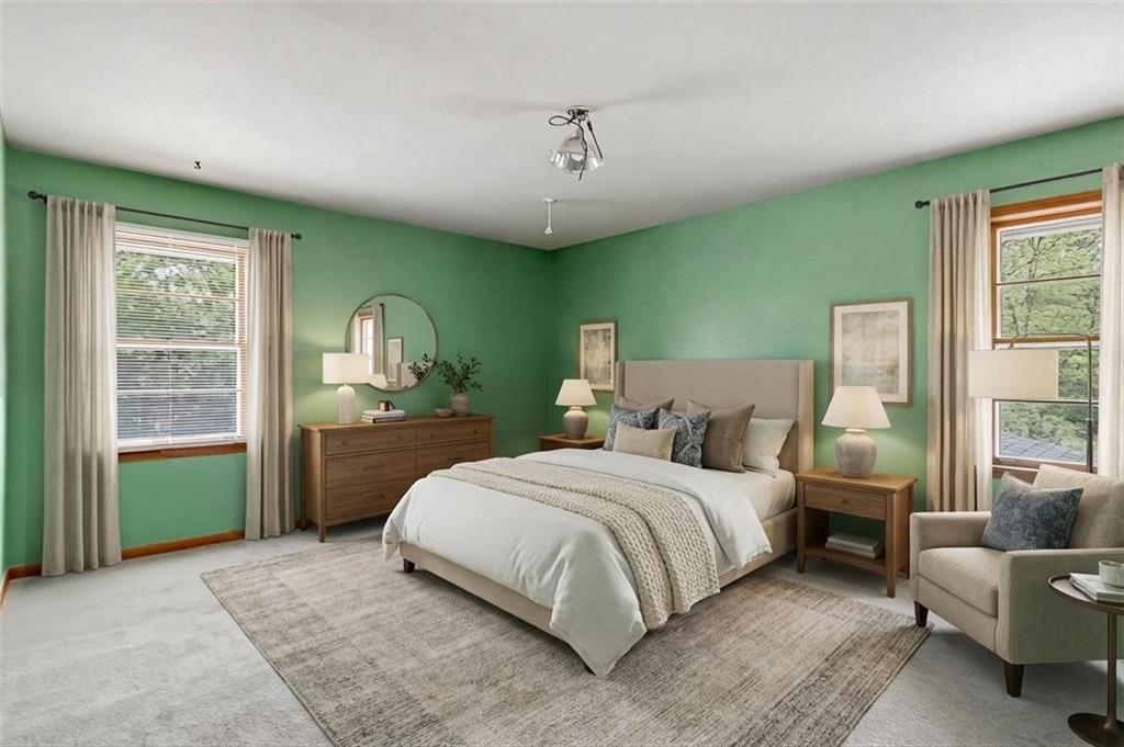 1315 Fairview Road Ellenwood, GA 30294 - Photo 16 of 34 a bedroom with a large bed and a window