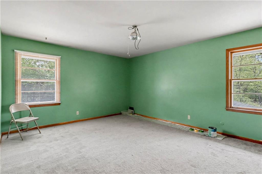 1315 Fairview Road Ellenwood, GA 30294 - Photo 17 of 34 a room with a window and a fan