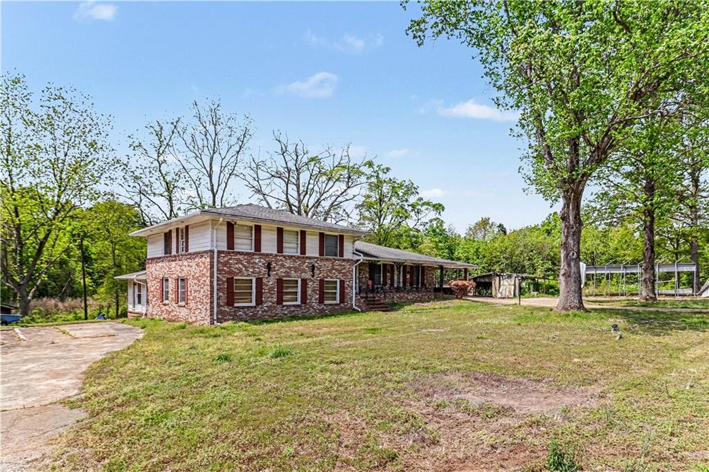 1315 Fairview Road Ellenwood, GA 30294 - Photo 2 of 34 a view of a house with a yard