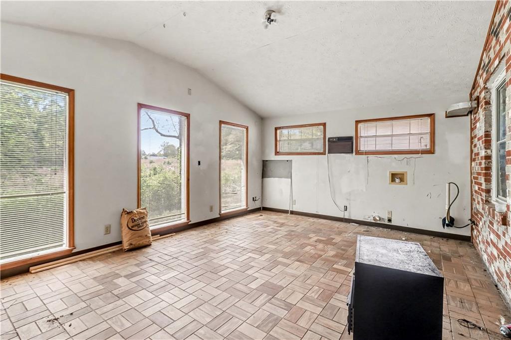 1315 Fairview Road Ellenwood, GA 30294 - Photo 23 of 34 a view of a livingroom with wooden floor and a window