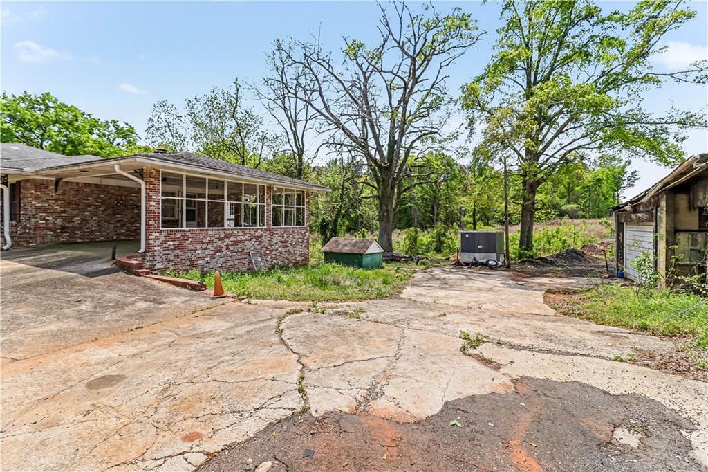1315 Fairview Road Ellenwood, GA 30294 - Photo 29 of 34 a view of house with yard and entertaining space