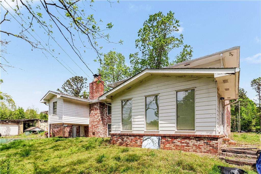 1315 Fairview Road Ellenwood, GA 30294 - Photo 30 of 34 front view of a house with an window