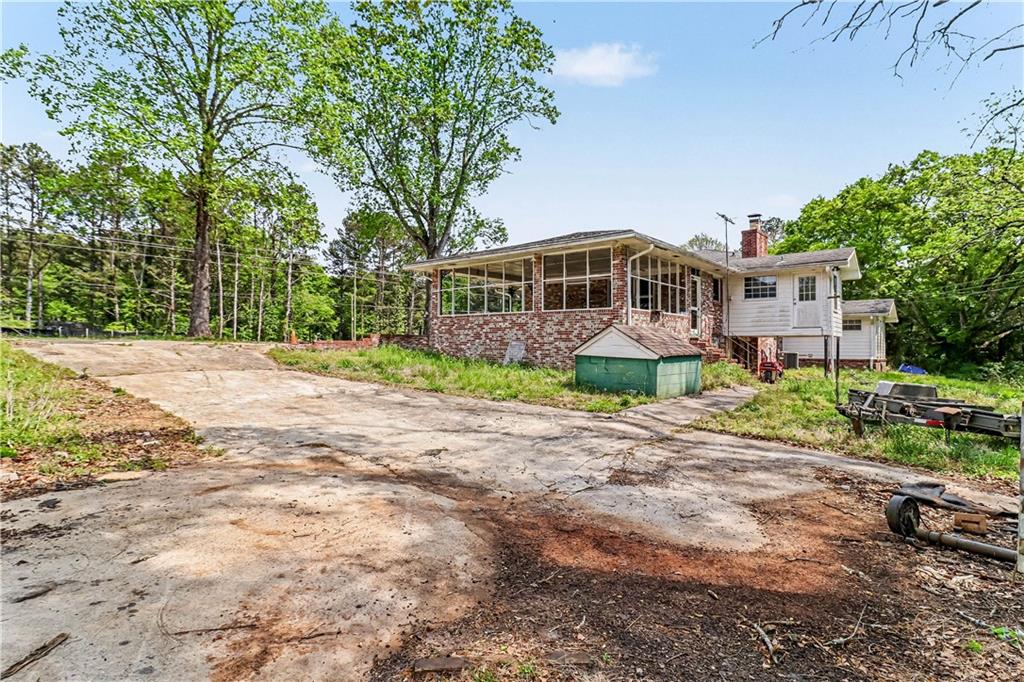 1315 Fairview Road Ellenwood, GA 30294 - Photo 31 of 34 a front view of a house with a garden