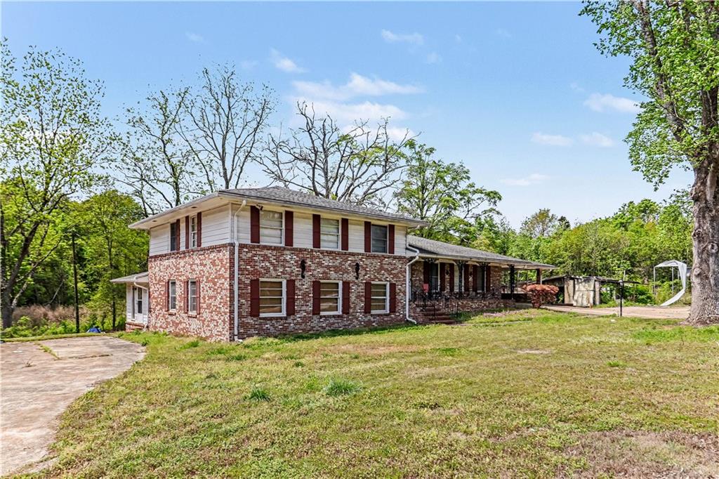 1315 Fairview Road Ellenwood, GA 30294 - Photo 4 of 34 front view of a house with a yard