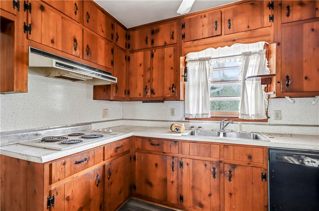 1315 Fairview Road Ellenwood, GA 30294 - Photo 8 of 34 a kitchen with stainless steel appliances granite countertop a sink stove and cabinets