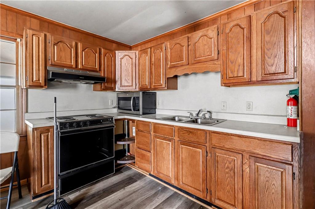 1315 Fairview Road Ellenwood, GA 30294 - Photo 9 of 34 a kitchen with stainless steel appliances granite countertop a stove and a sink