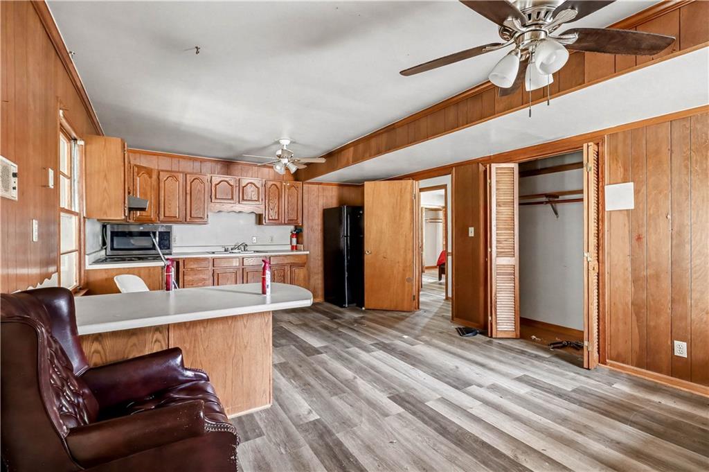 1315 Fairview Road Ellenwood, GA 30294 - Photo 10 of 34 a living room with stainless steel appliances kitchen island granite countertop furniture and a kitchen view