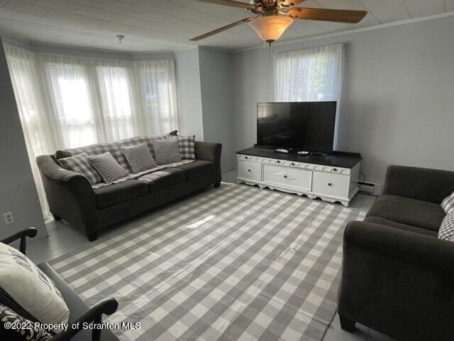 991 Main Street Rome, PA 18837 - Photo 14 of 53 a living room with furniture and a flat screen tv