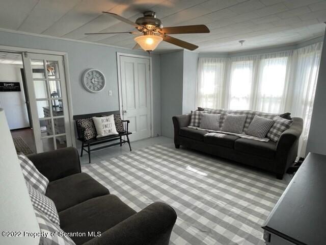 991 Main Street Rome, PA 18837 - Photo 16 of 53 a living room with furniture and a wooden floor