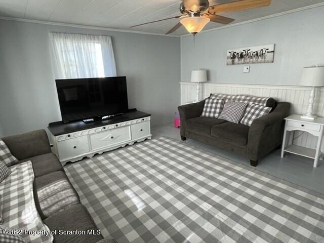 991 Main Street Rome, PA 18837 - Photo 18 of 53 a living room with furniture and a flat screen tv