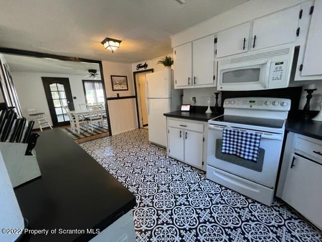 991 Main Street Rome, PA 18837 - Photo 28 of 53 a kitchen with granite countertop a stove a sink and a refrigerator