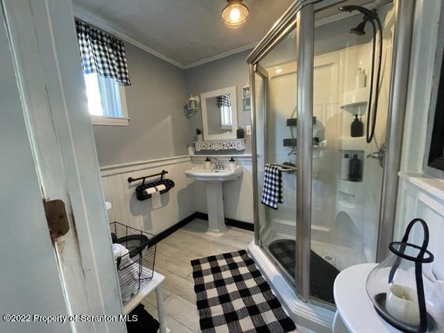 991 Main Street Rome, PA 18837 - Photo 30 of 53 a bathroom with a sink a toilet a mirror and shower