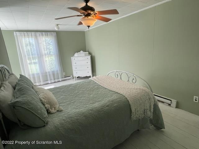 991 Main Street Rome, PA 18837 - Photo 39 of 53 a bedroom with a bed and a chandelier