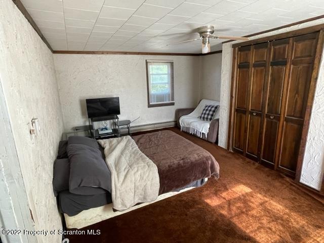991 Main Street Rome, PA 18837 - Photo 41 of 53 a bed sitting in a bedroom next to a window