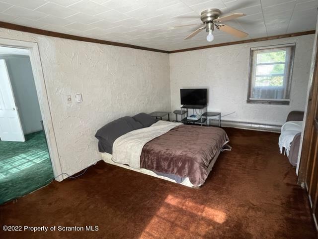 991 Main Street Rome, PA 18837 - Photo 44 of 53 a bedroom with a bed and wooden floor