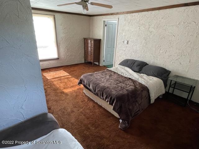 991 Main Street Rome, PA 18837 - Photo 45 of 53 a bedroom with a bed and a window