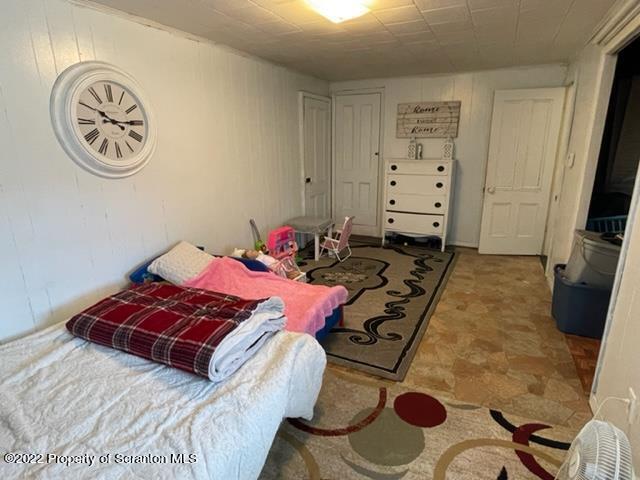 991 Main Street Rome, PA 18837 - Photo 51 of 53 a bedroom with a bed and a chandelier