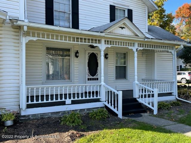 991 Main Street Rome, PA 18837 - Photo 8 of 53 a view of a house with a small yard and plants
